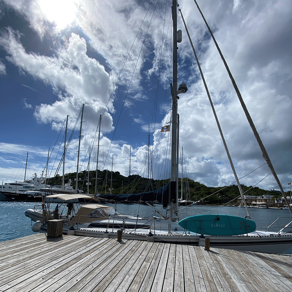 Sailboat at a fueldock filling up water because there is no watermaker aboard.